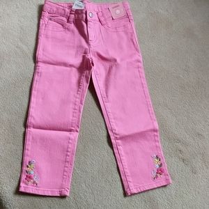 Bright pink jeans with embroidered flowers